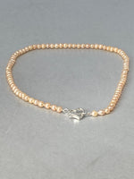 Load image into Gallery viewer, Pink Pearl Necklace with a Silver Heart Clasp
