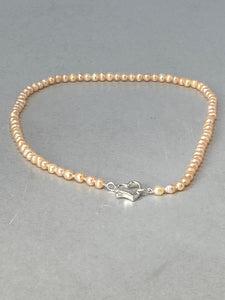 Pink Pearl Necklace with a Silver Heart Clasp