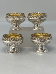 Superb Set of Four Antique Sterling Silver Embossed Salts with original gilt interiors and excellent condition