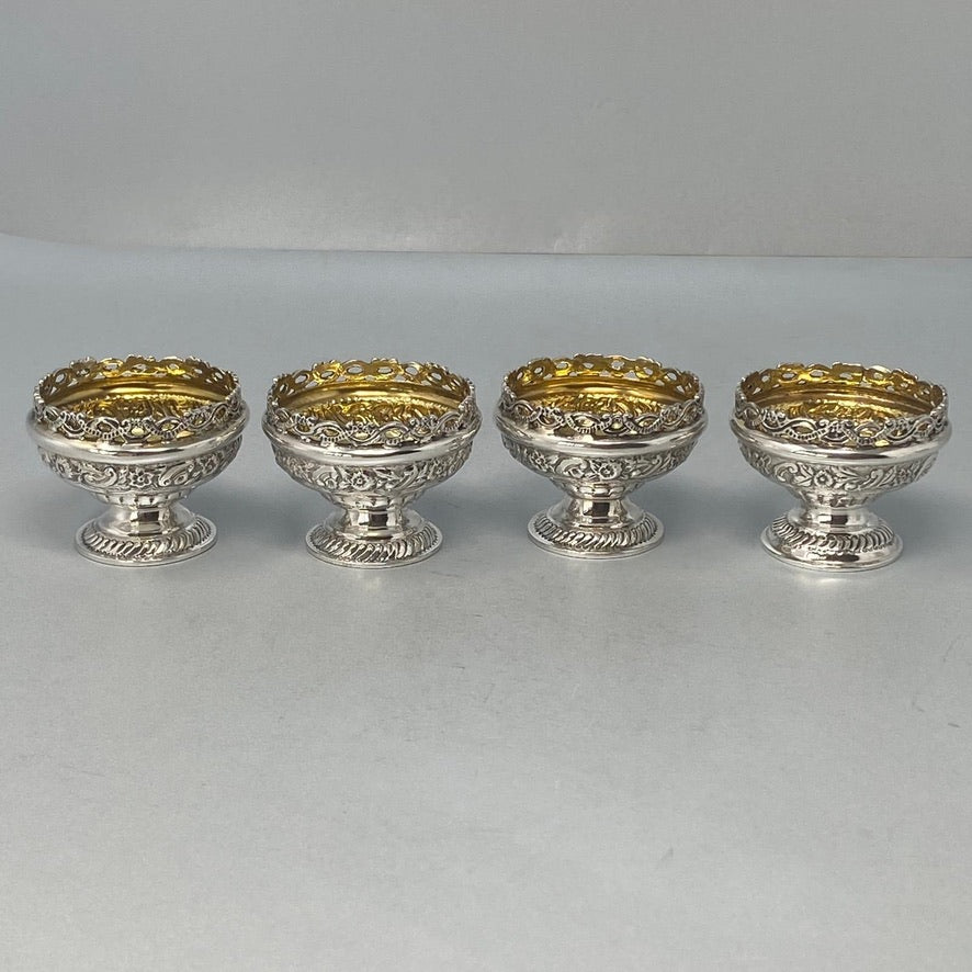 Superb Set of Four Antique Sterling Silver Embossed Salts with original gilt interiors and excellent condition