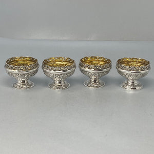 Superb Set of Four Antique Sterling Silver Embossed Salts with original gilt interiors and excellent condition