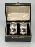 Load image into Gallery viewer, A pair of Antique Sterling Silver Napkin Rings in original box

