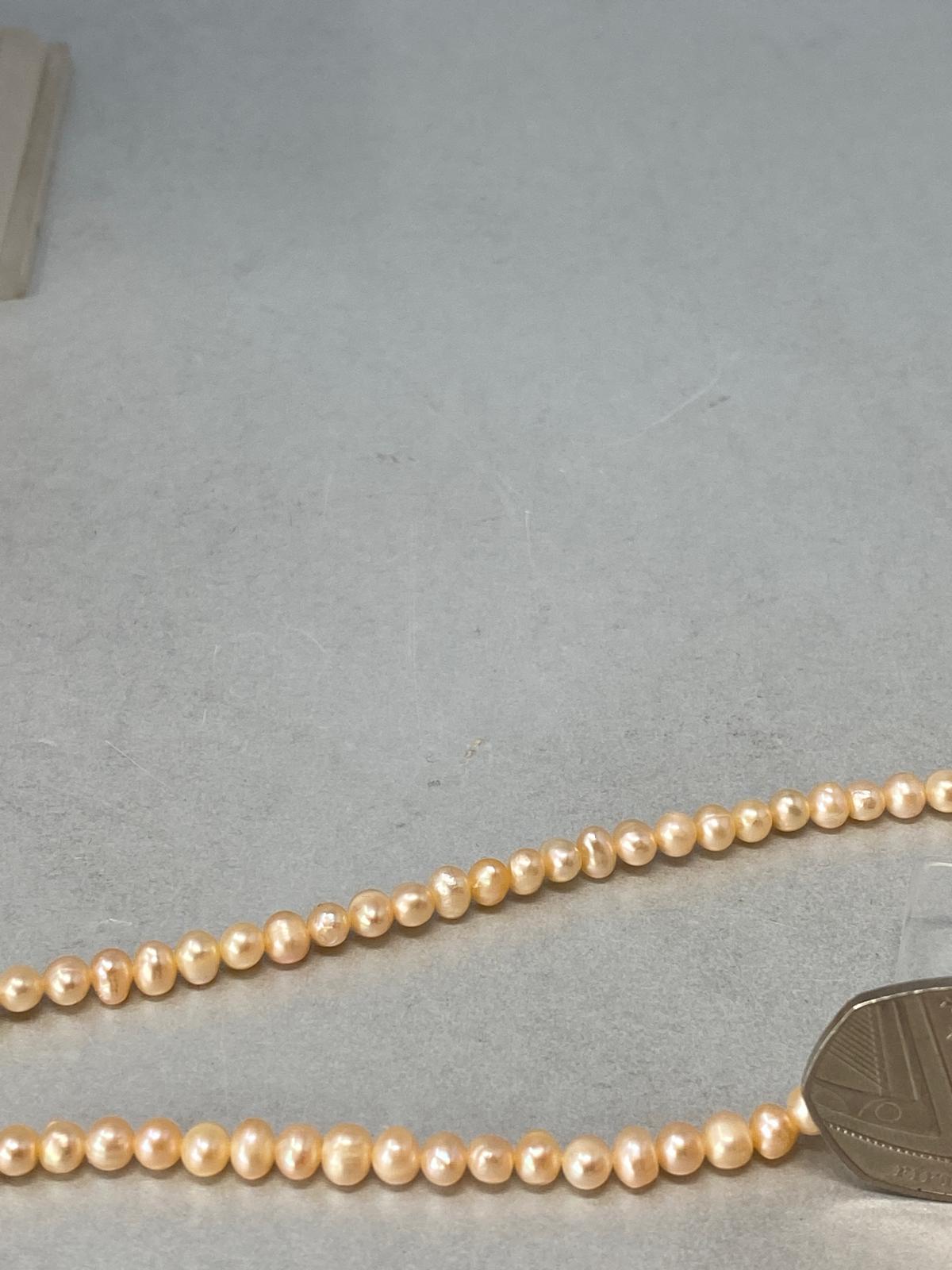 Pink Pearl Necklace with a Silver Heart Clasp