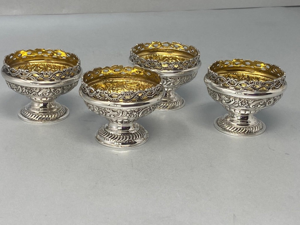 Superb Set of Four Antique Sterling Silver Embossed Salts with original gilt interiors and excellent condition