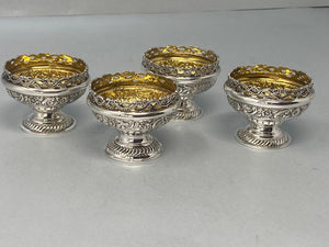 Superb Set of Four Antique Sterling Silver Embossed Salts with original gilt interiors and excellent condition