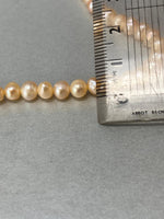 Load image into Gallery viewer, Pink Pearl Necklace with a Silver Heart Clasp
