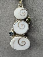 Load image into Gallery viewer, Sterling Silver and Sea Shell with Blue Topaz and Peridot Stone Pendant on Snake Chain
