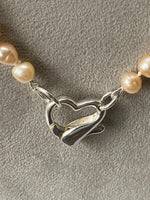 Load image into Gallery viewer, Pink Pearl Necklace with a Silver Heart Clasp
